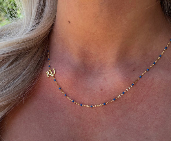 N201 KAN-The Kansas University Logo Necklace: Side Set KU Logo on Blue Enamel Bead Necklace